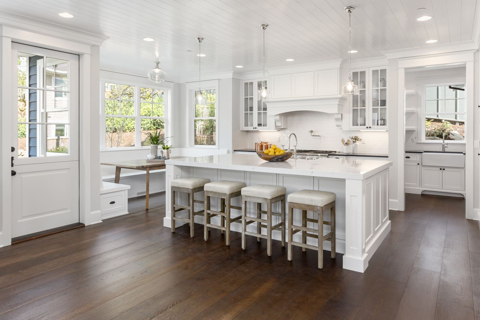 Bright white kitchen with island seating